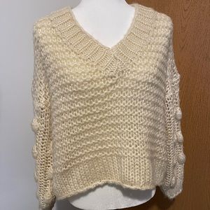 Cream balloon sleeved sweater with poms